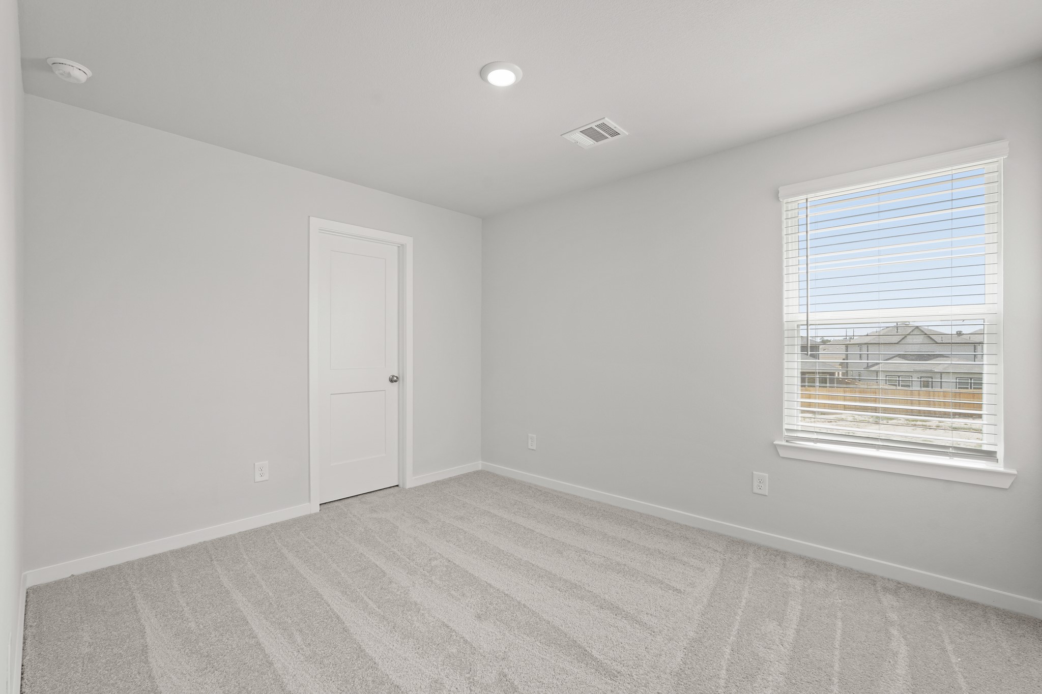 213 Spring Drive Hockley, TX 77447 - Photo 18 of 26 an empty room with a window
