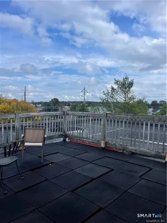 a view of a chairs with wooden floor
