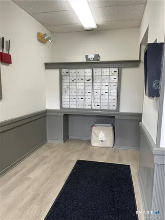 a living room with a large window and a flat screen tv