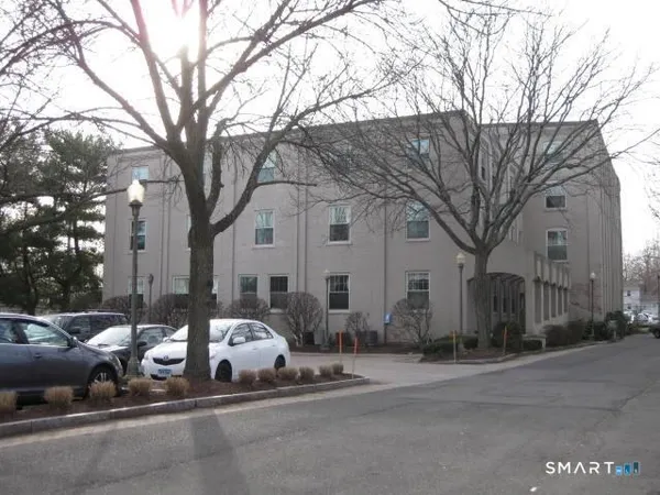a group of cars parked in front of a house