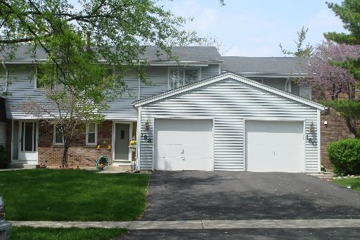 188 Roberts Road, Unit 188 Bolingbrook, IL 60440 - Photo 1 of 1 a front view of house with a garden