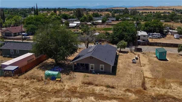 an aerial view of a house with pool