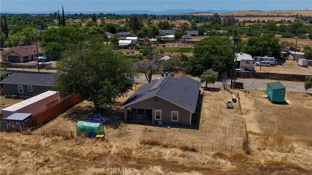an aerial view of a house with pool