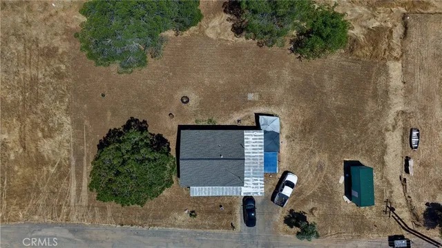 an aerial view of a house with outdoor space