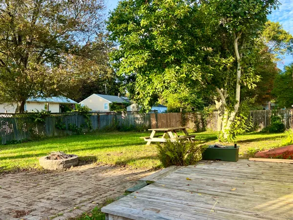 a view of a house with swimming pool and sitting area