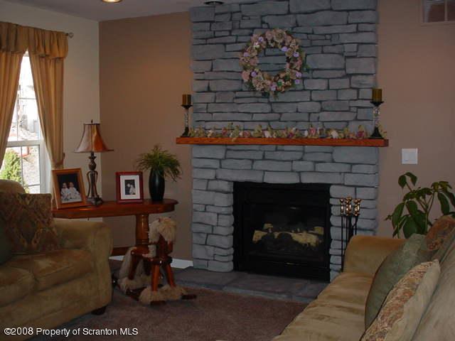 2622 Boulder Road Lake Ariel, PA 18436 - Photo 3 of 9 a living room with furniture and a fireplace
