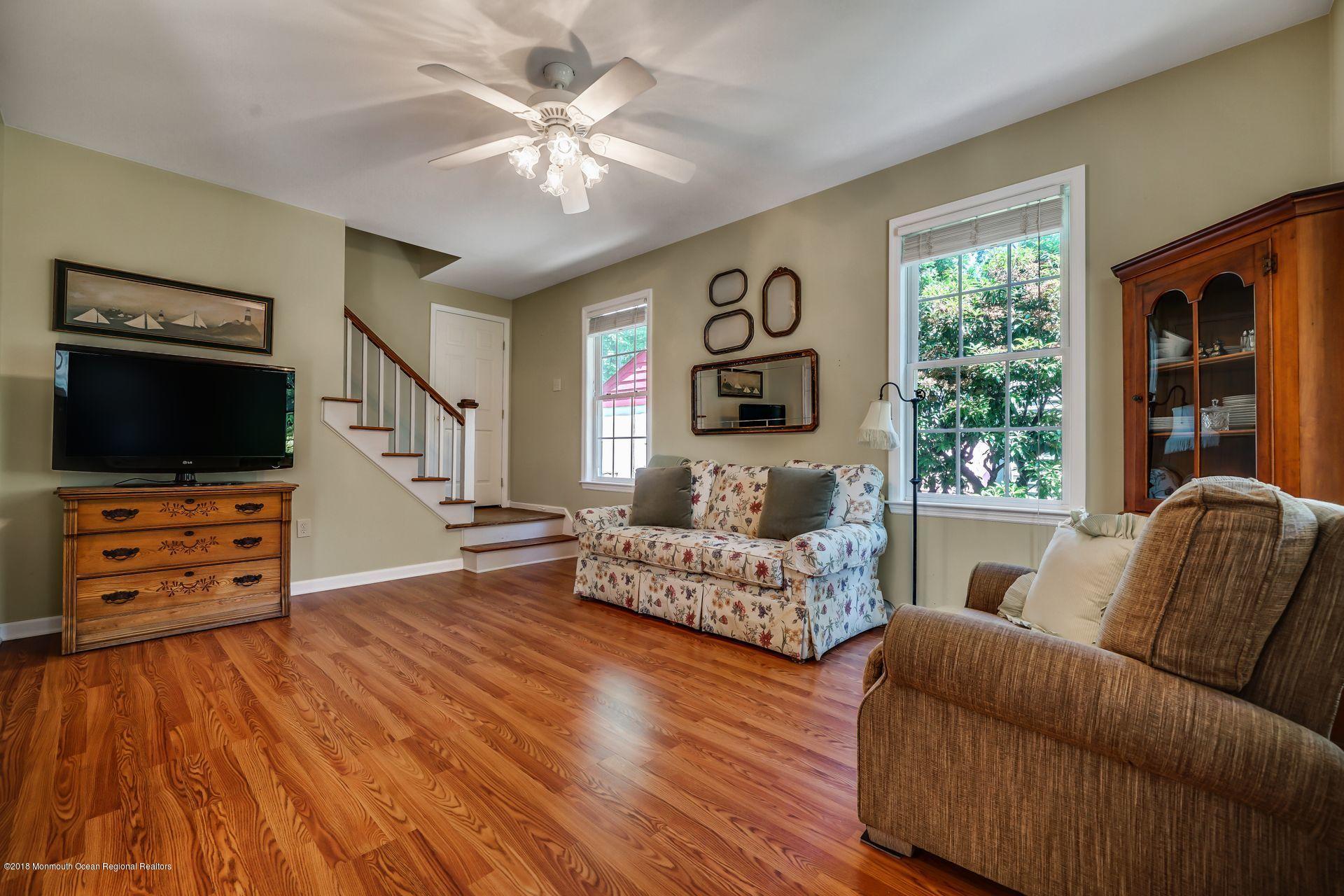 2569 Crestview Road Manasquan, NJ 08736 - Photo 12 of 35 a living room with furniture and a flat screen tv