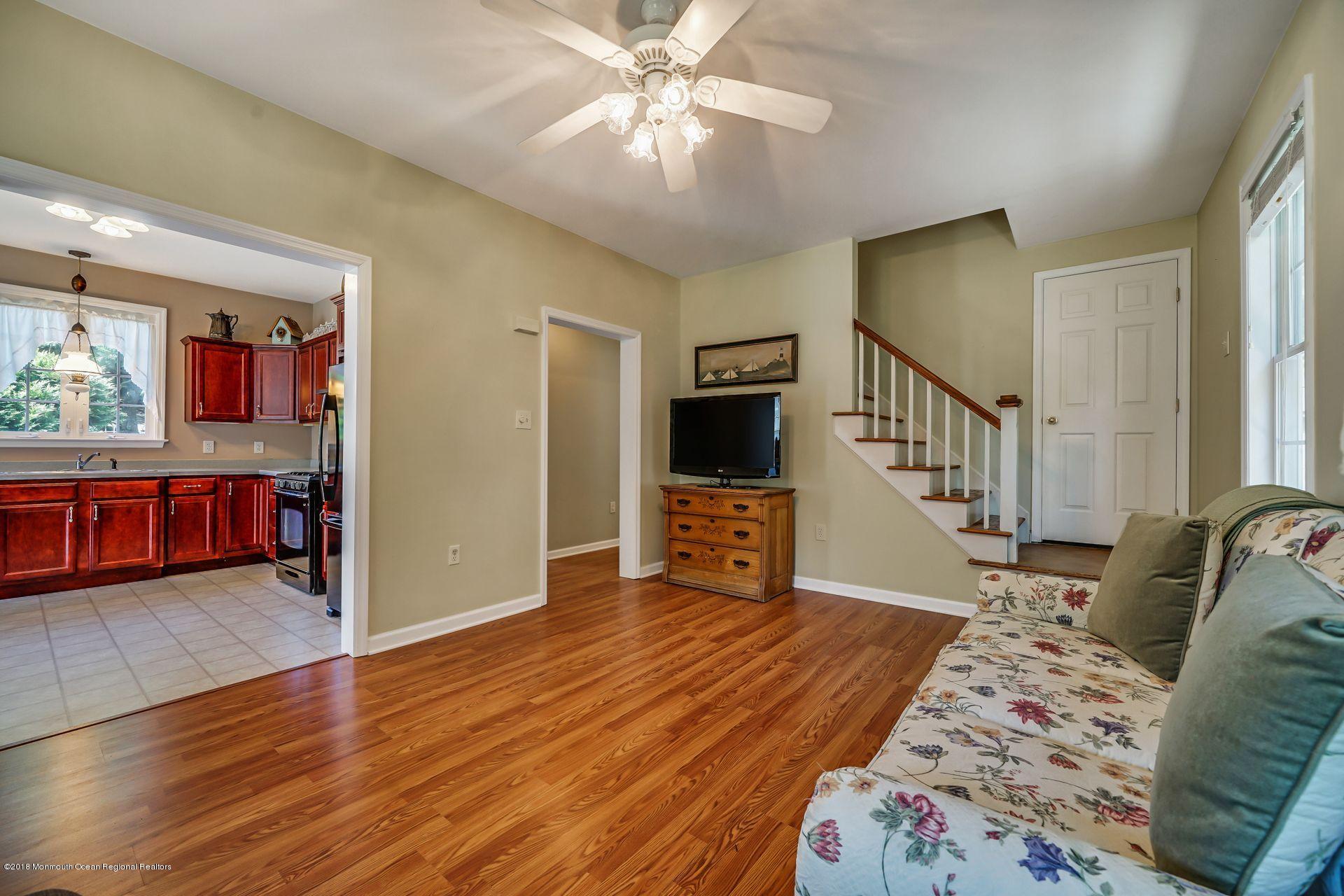 2569 Crestview Road Manasquan, NJ 08736 - Photo 13 of 35 a living room with furniture and a flat screen tv