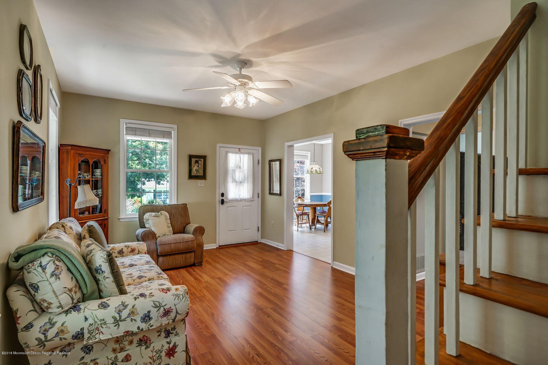 2569 Crestview Road Manasquan, NJ 08736 - Photo 14 of 35 a living room with furniture and a chandelier