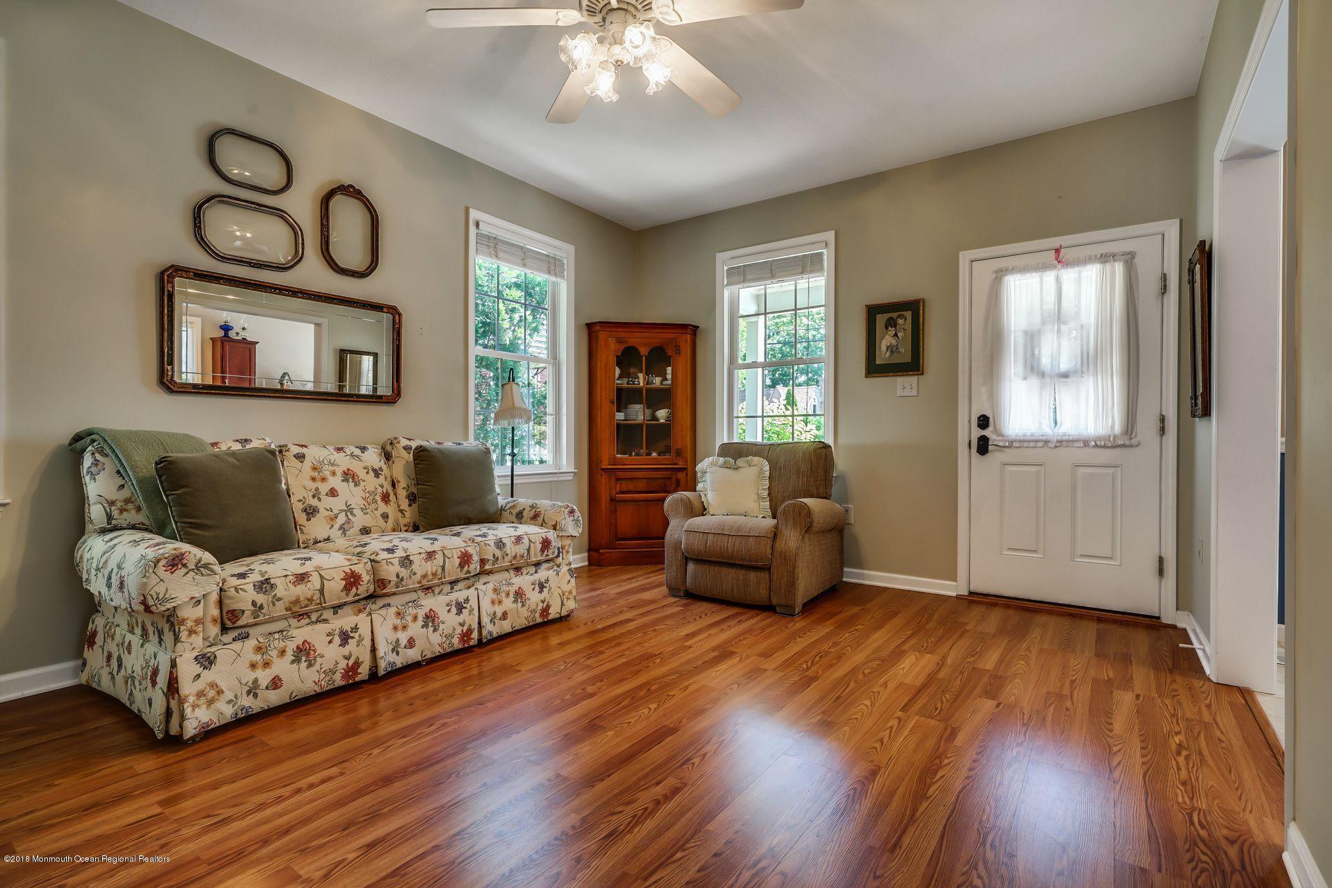 2569 Crestview Road Manasquan, NJ 08736 - Photo 15 of 35 a living room with furniture and a wooden floor