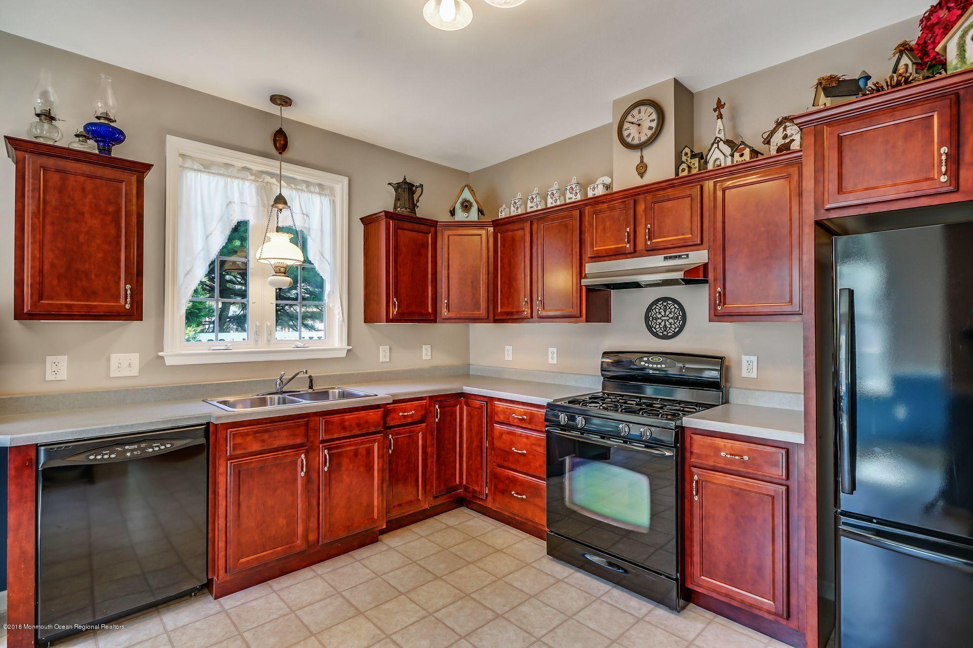 2569 Crestview Road Manasquan, NJ 08736 - Photo 18 of 35 a kitchen with stainless steel appliances granite countertop a stove top oven a sink and dishwasher