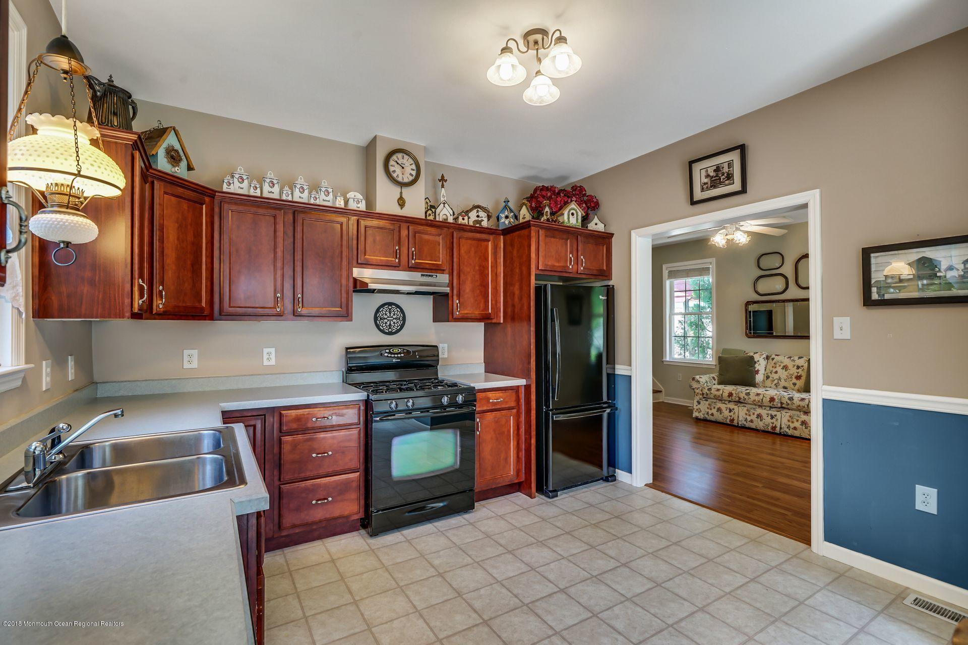 2569 Crestview Road Manasquan, NJ 08736 - Photo 19 of 35 a kitchen with stainless steel appliances granite countertop a stove top oven a sink a counter top space and cabinets