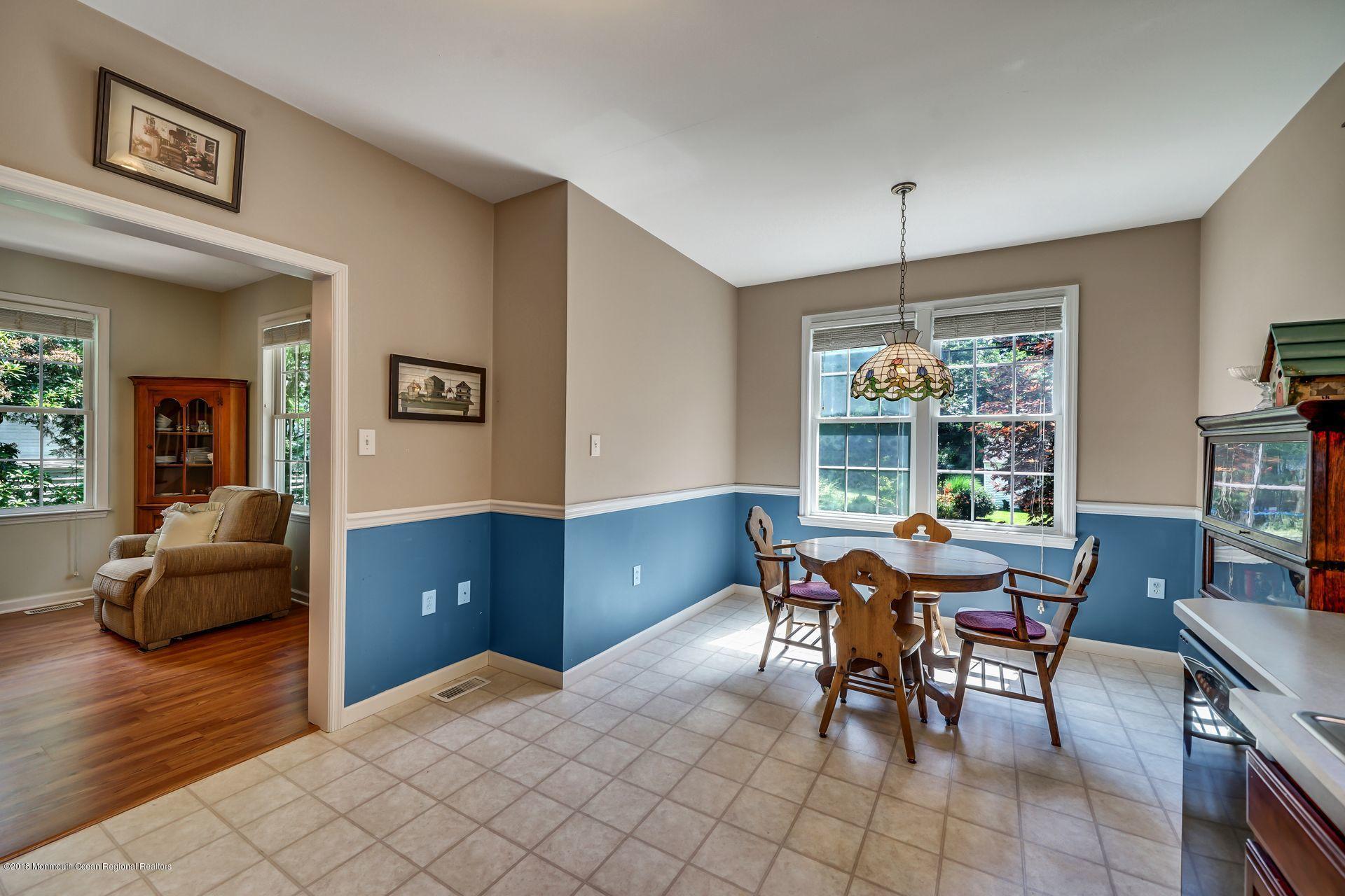 2569 Crestview Road Manasquan, NJ 08736 - Photo 20 of 35 a view of a dining room with furniture window and wooden floor