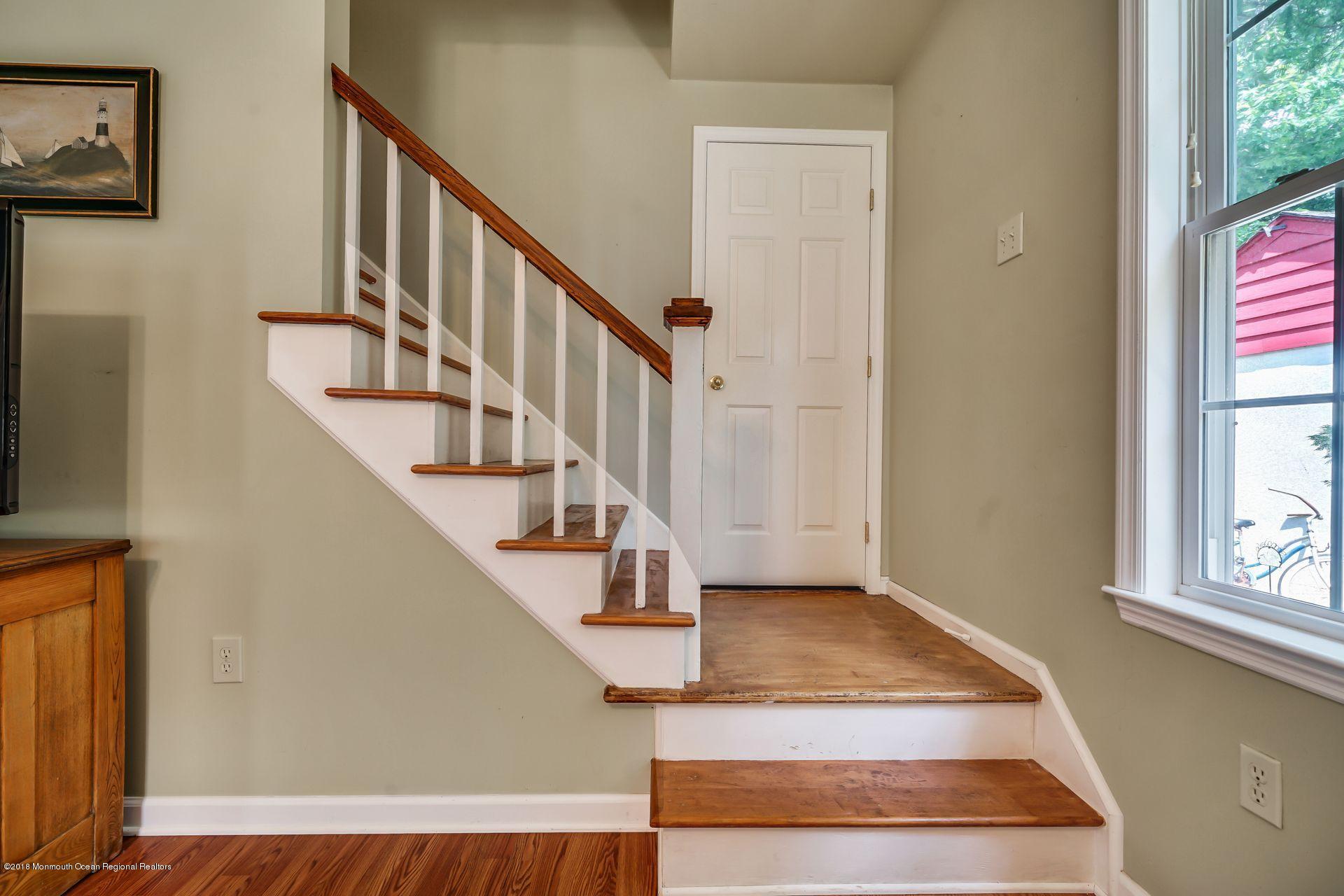2569 Crestview Road Manasquan, NJ 08736 - Photo 26 of 35 a view of entryway and hall with wooden floor