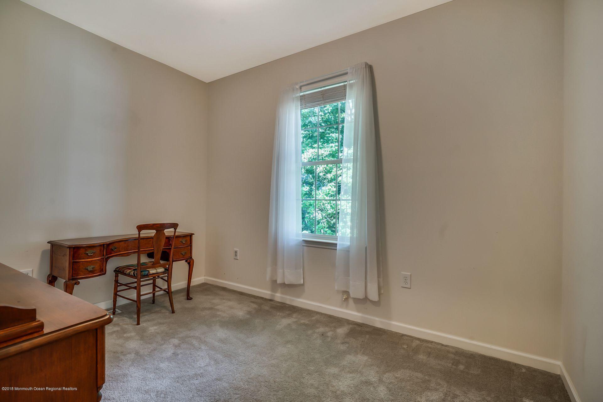 2569 Crestview Road Manasquan, NJ 08736 - Photo 27 of 35 a room with furniture and a window