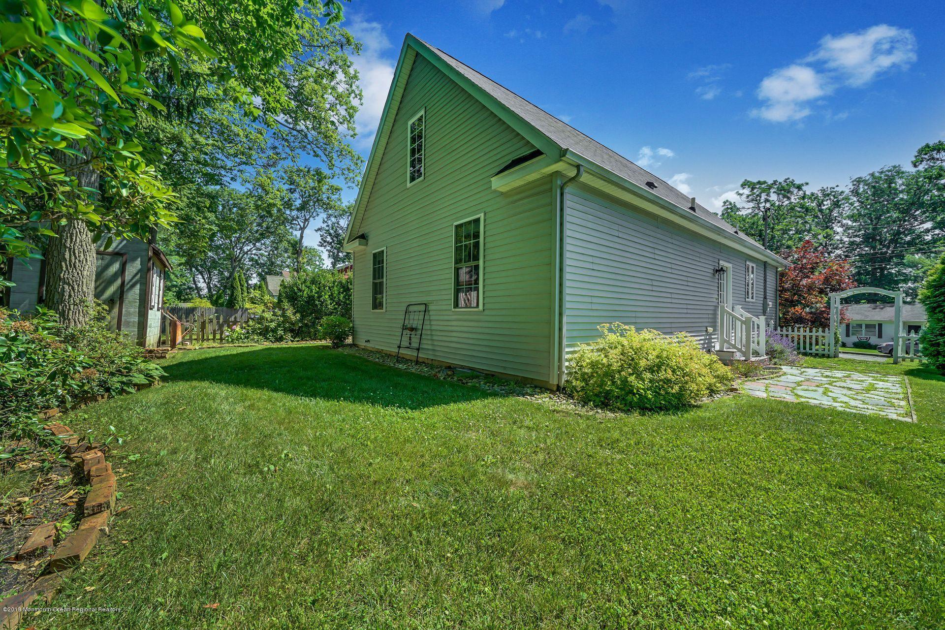 2569 Crestview Road Manasquan, NJ 08736 - Photo 34 of 35 a green field in front of the house