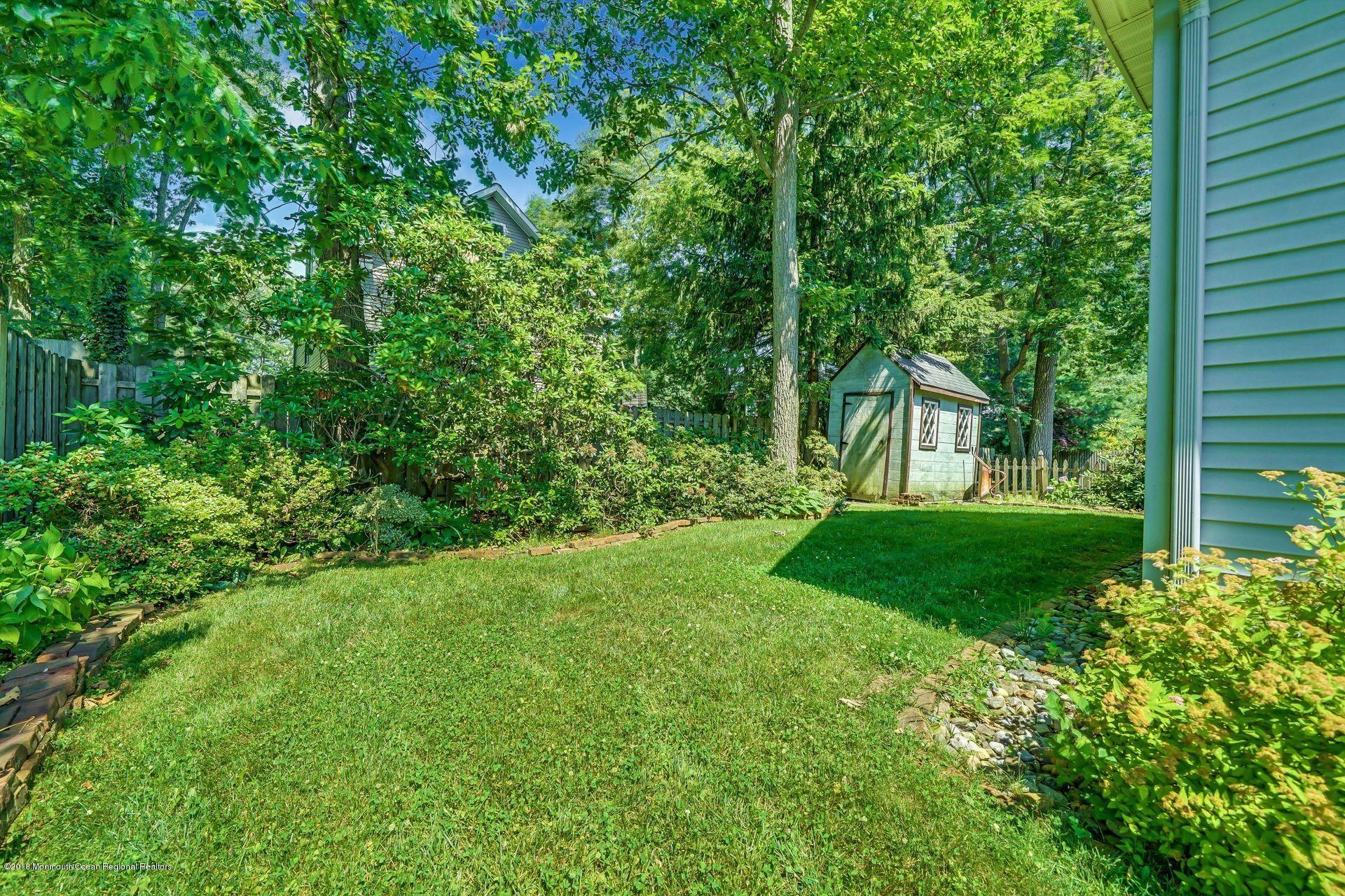 2569 Crestview Road Manasquan, NJ 08736 - Photo 35 of 35 a view of a house with backyard and garden