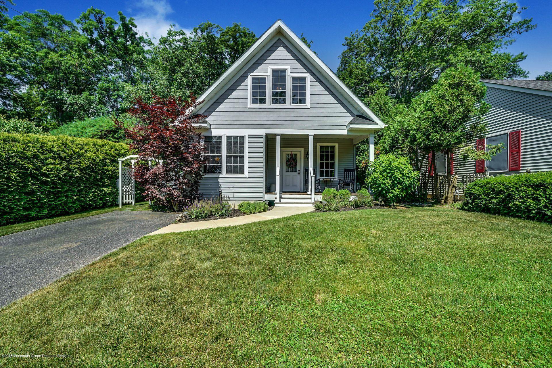 2569 Crestview Road Manasquan, NJ 08736 - Photo 6 of 35 a front view of a house with yard and green space