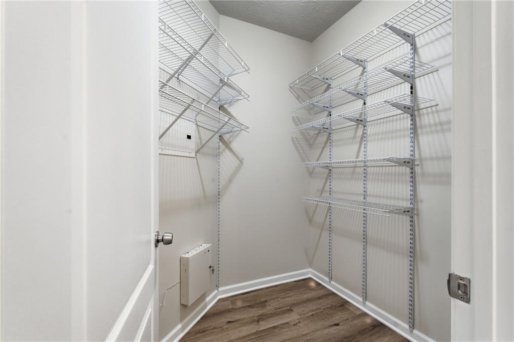 4533 Caleb Crossing, Unit 18 Powder Springs, GA 30127 - Photo 16 of 24 a view of a room with racks on the wall