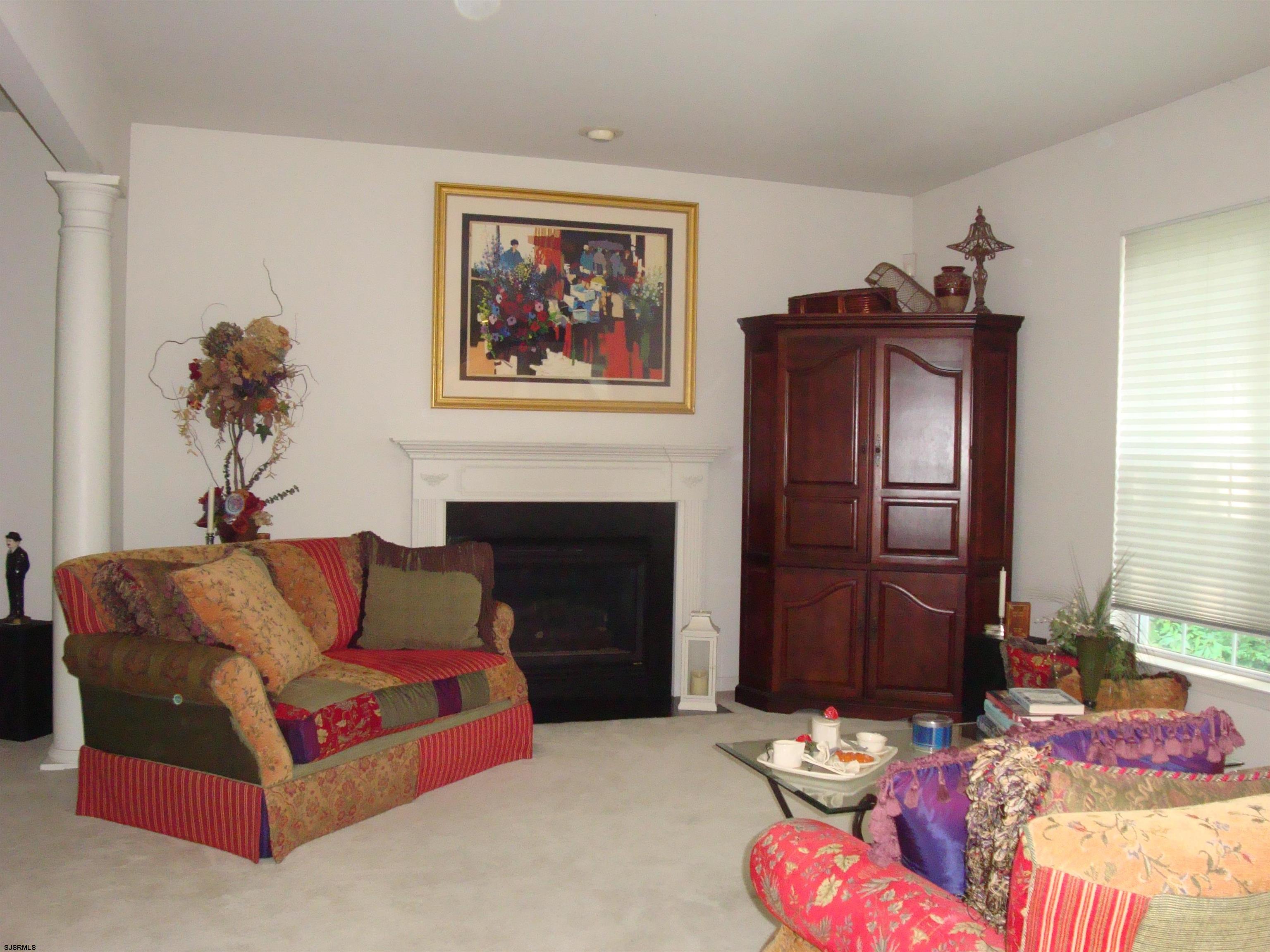 6 Devon Drive Egg Harbor Township, NJ 08234 - Photo 11 of 23 a living room with furniture fireplace and flat screen tv