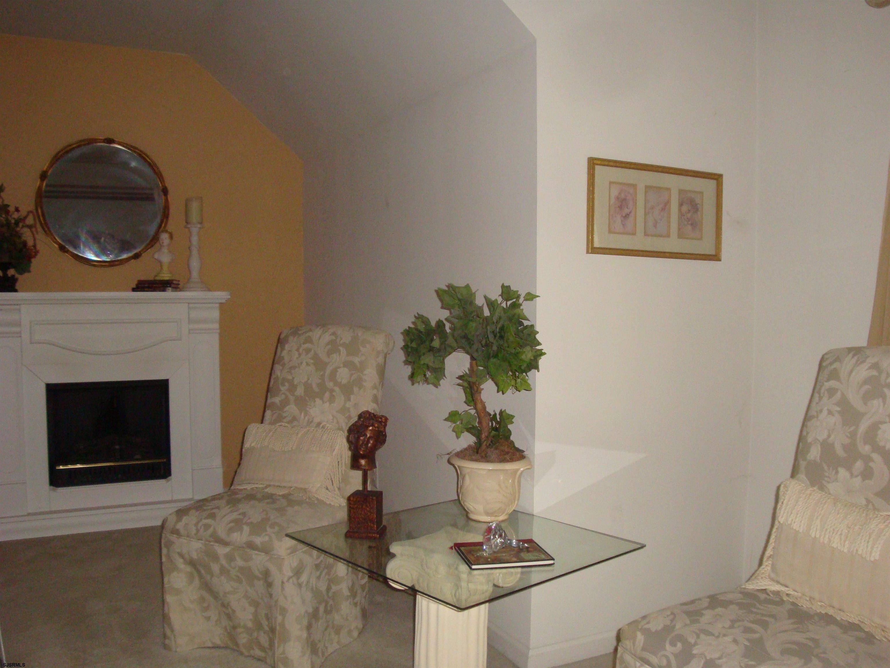 6 Devon Drive Egg Harbor Township, NJ 08234 - Photo 13 of 23 a living room with furniture and a fireplace