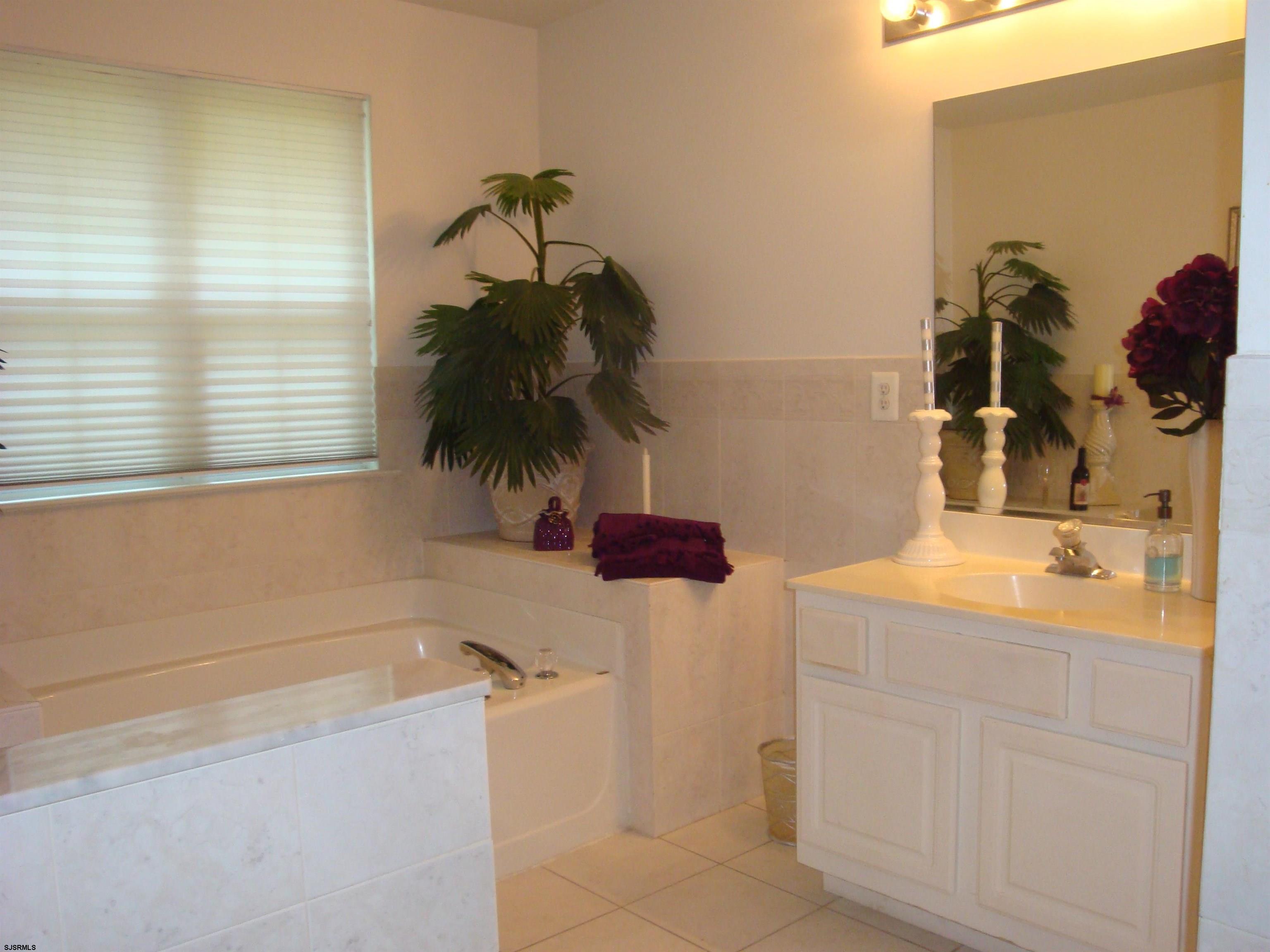 6 Devon Drive Egg Harbor Township, NJ 08234 - Photo 15 of 23 a bathroom with a sink and a tub