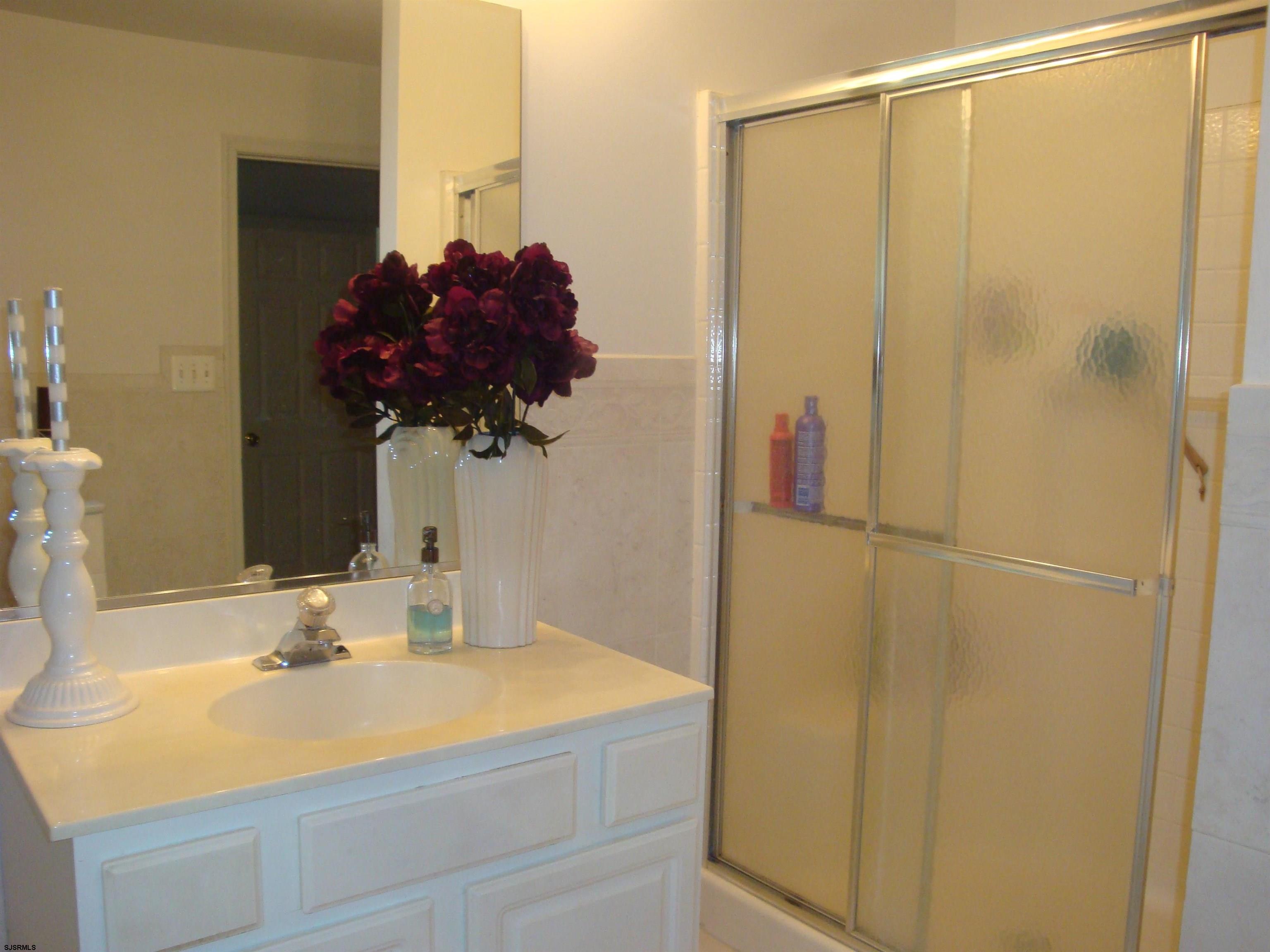 6 Devon Drive Egg Harbor Township, NJ 08234 - Photo 16 of 23 a bathroom with a sink and a mirror