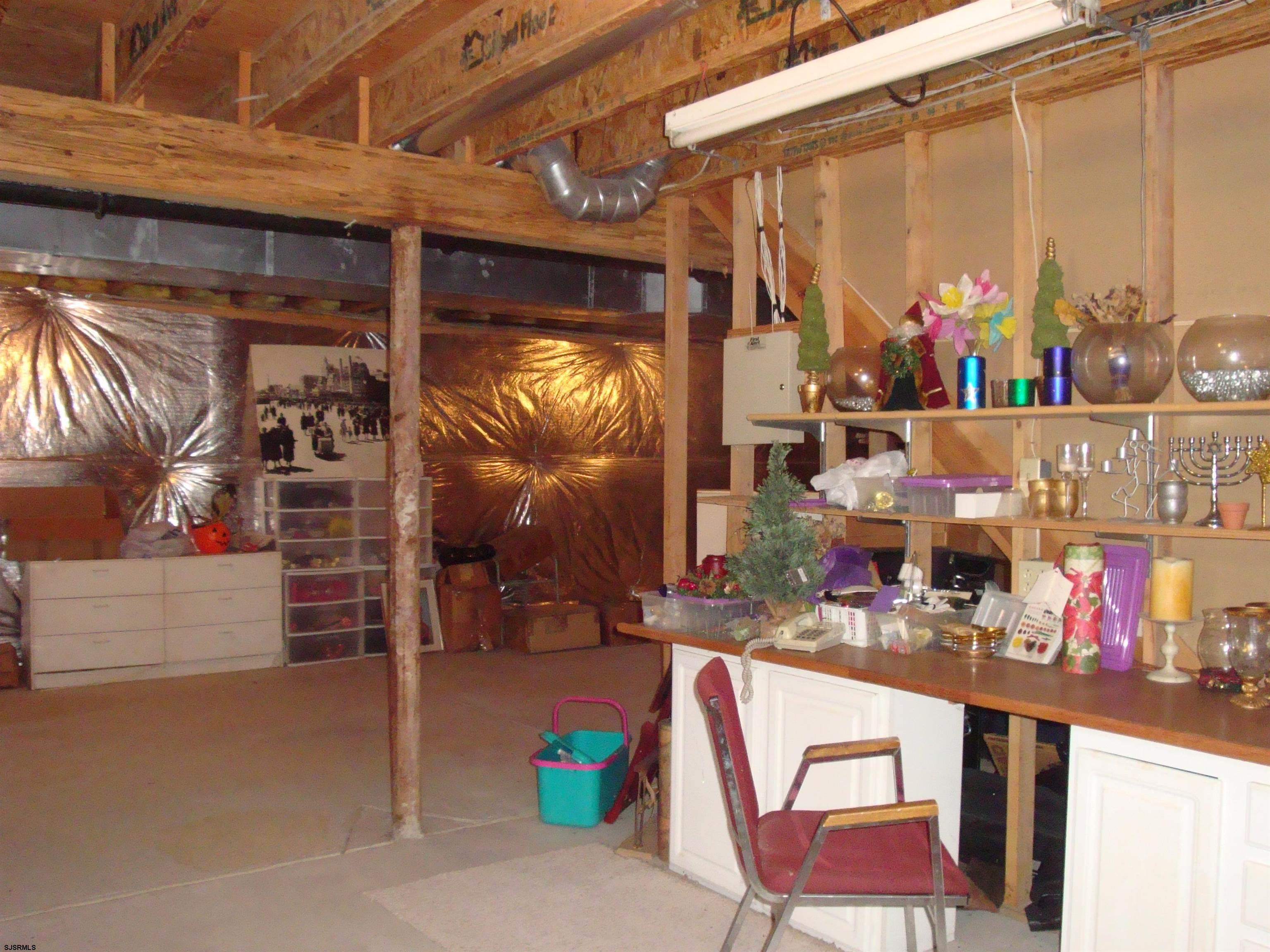 6 Devon Drive Egg Harbor Township, NJ 08234 - Photo 21 of 23 a room with storage and a table