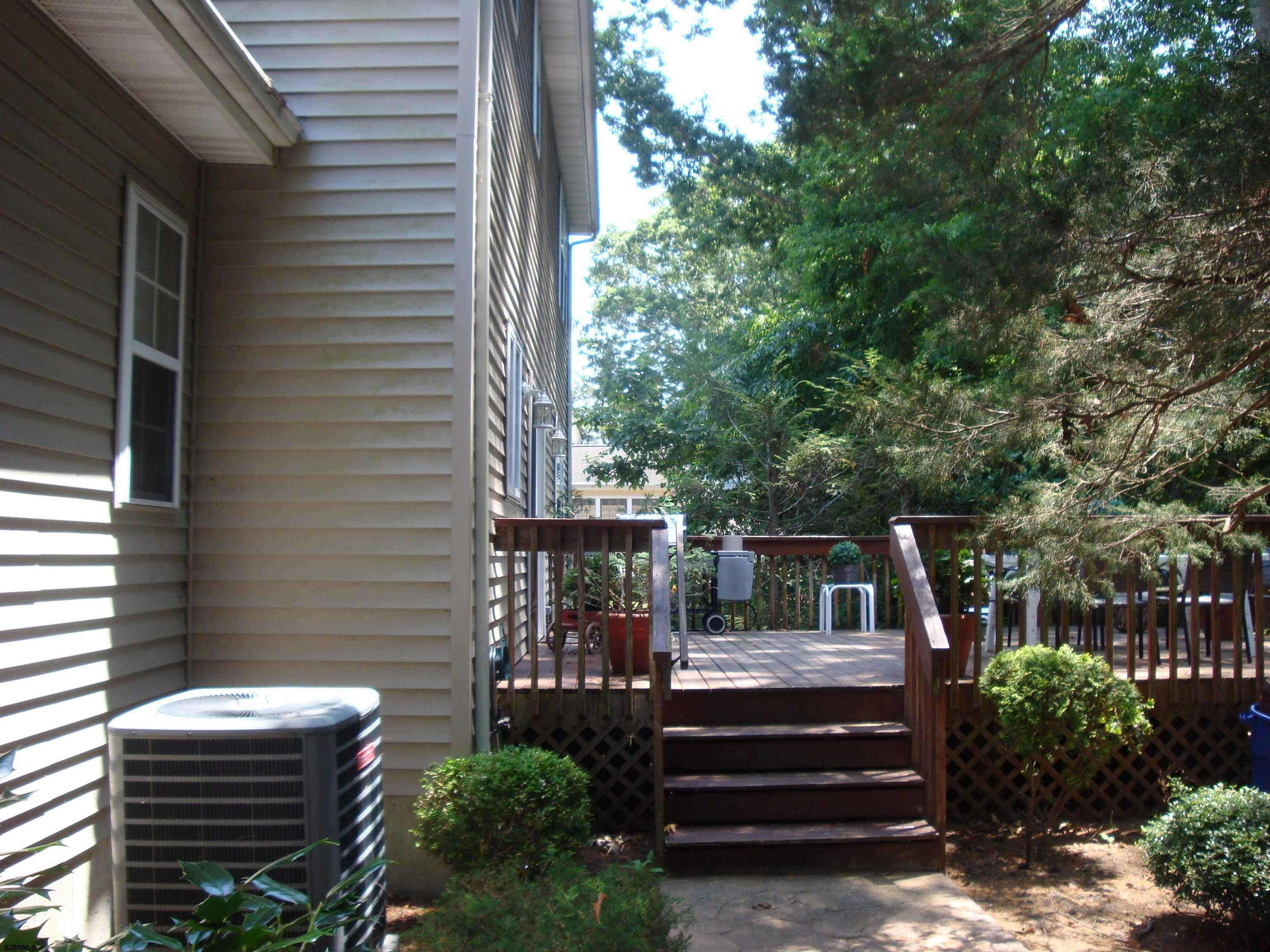 6 Devon Drive Egg Harbor Township, NJ 08234 - Photo 22 of 23 a view of backyard with seating space and trees