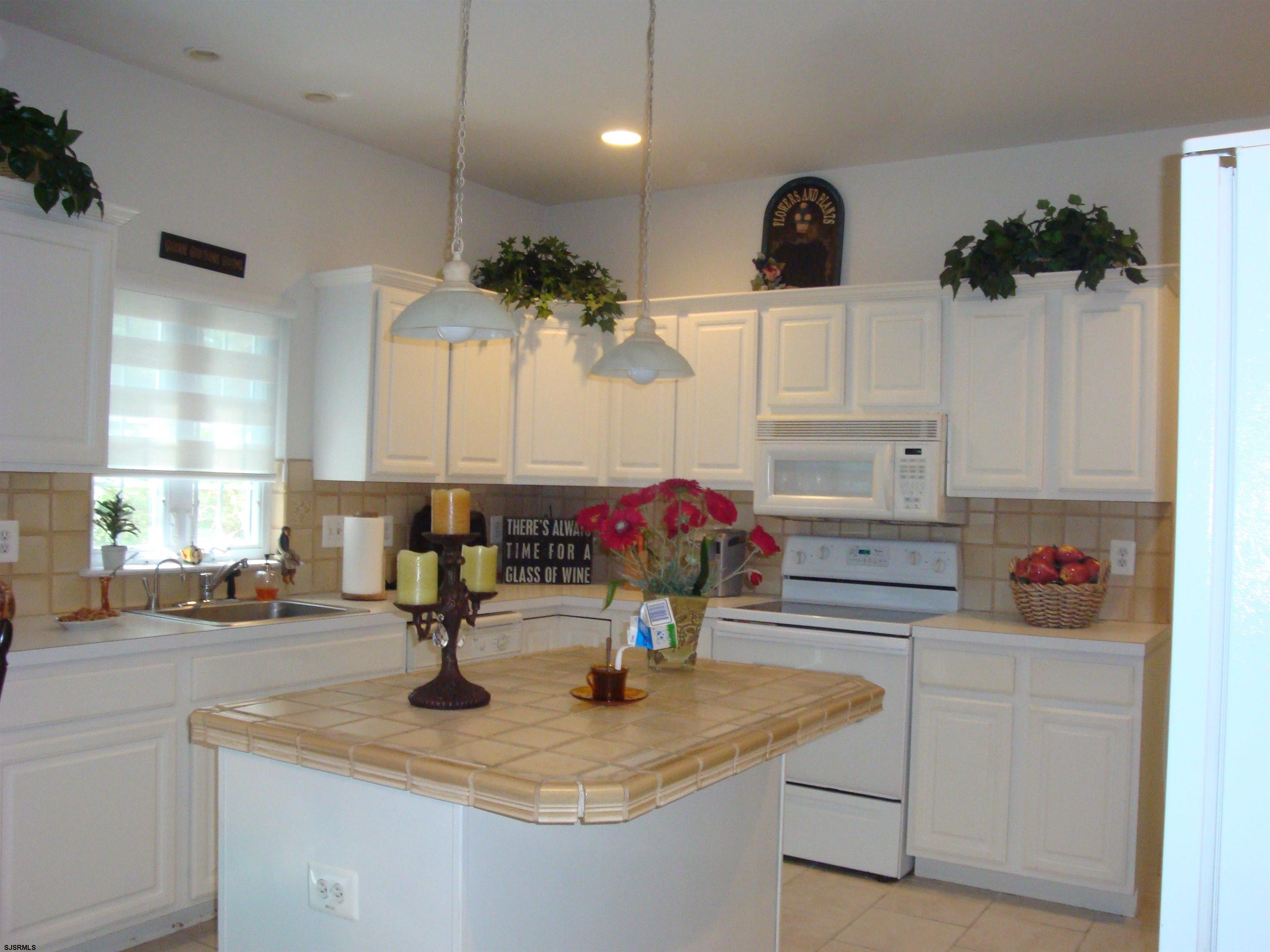 6 Devon Drive Egg Harbor Township, NJ 08234 - Photo 9 of 23 a kitchen with a sink and cabinets