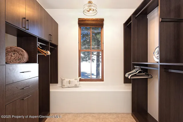a bathroom with a bathtub and a window