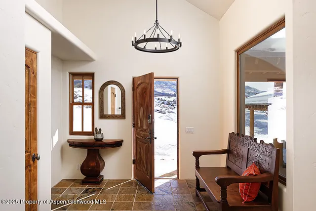 a view of a livingroom with furniture and windows