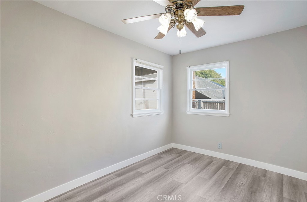 315 West Elm Street Brea, CA 92821 - Photo 6 of 14 an empty room with a window and a fan