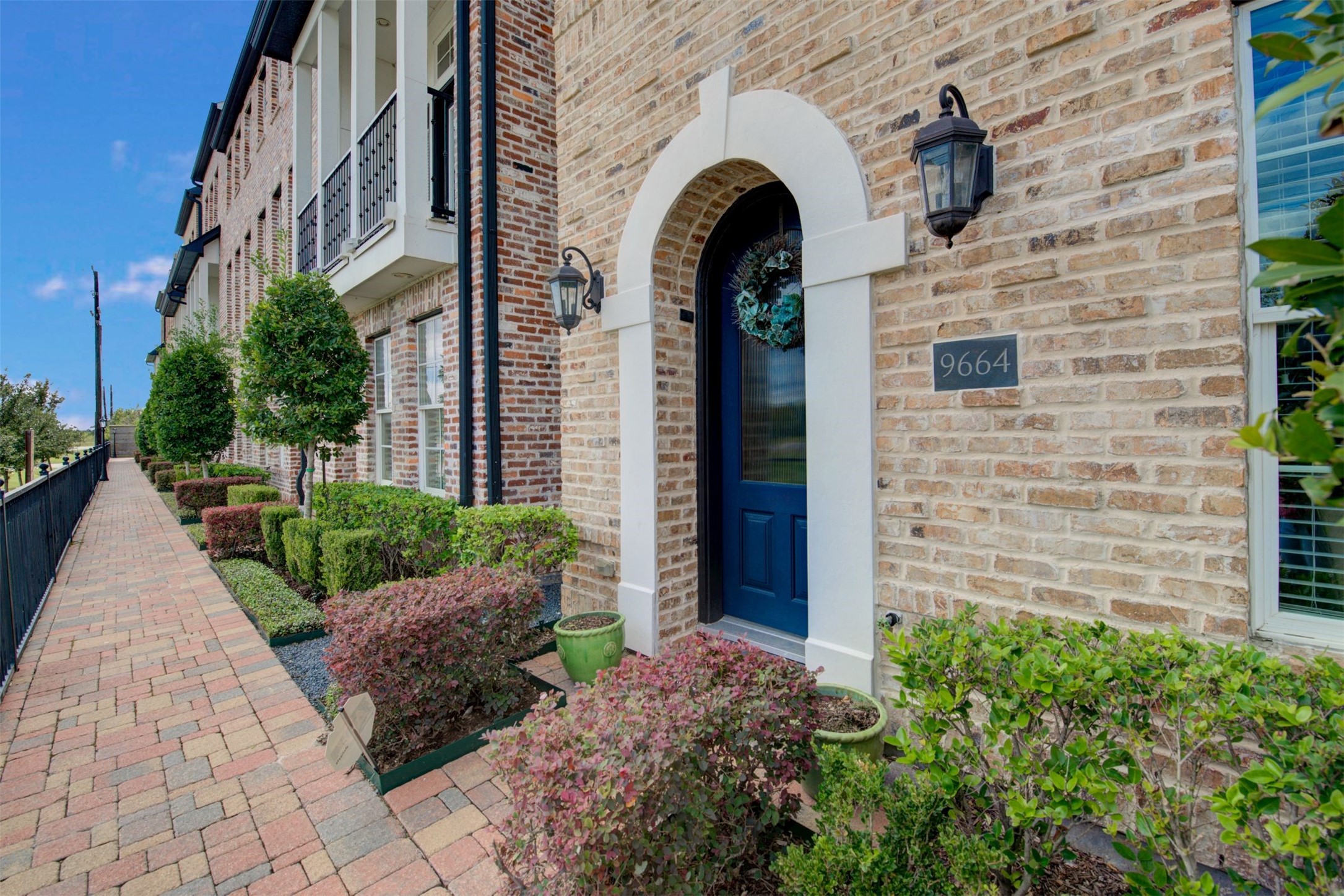 9664 Knight Road Houston, TX 77045 - Photo 1 of 33 a view of entrance gate of a house with brick walls
