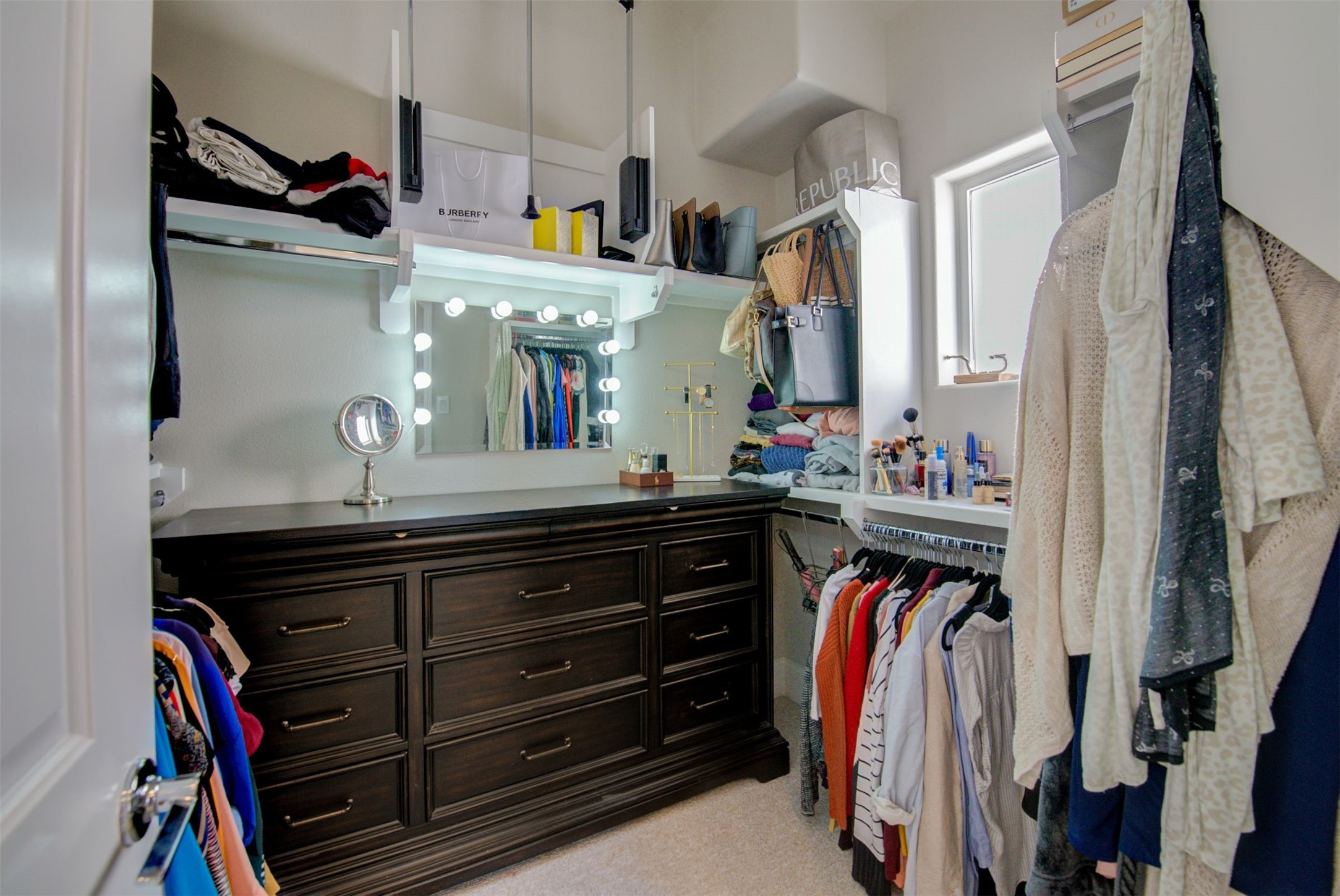 9664 Knight Road Houston, TX 77045 - Photo 20 of 33 a view of walk in closet with clothes and shoes