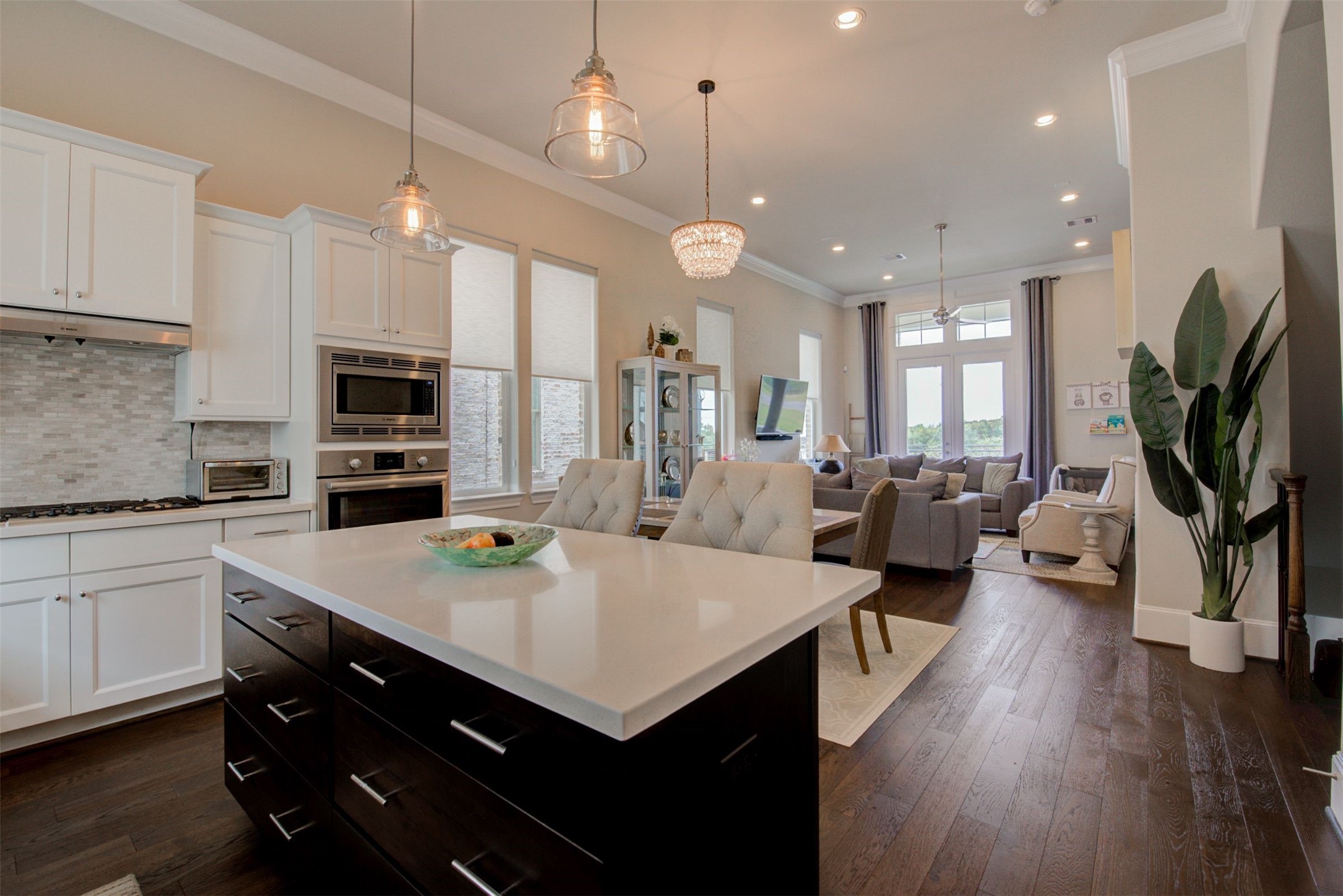 9664 Knight Road Houston, TX 77045 - Photo 2 of 33 a large kitchen with sink a refrigerator and chairs