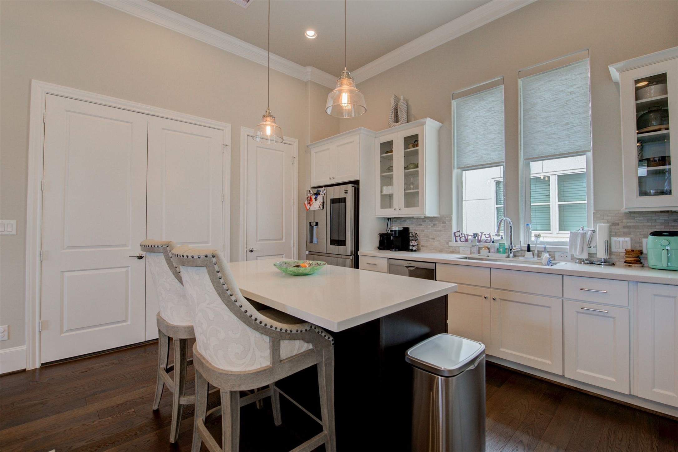 9664 Knight Road Houston, TX 77045 - Photo 21 of 33 a kitchen with a sink cabinets and wooden floor