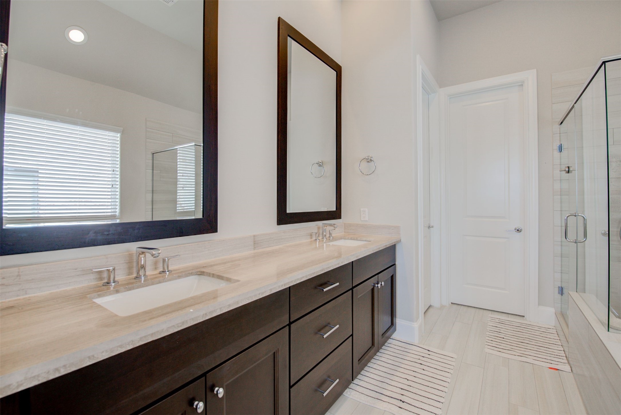 9664 Knight Road Houston, TX 77045 - Photo 24 of 33 a bathroom with a granite countertop sink and a mirror