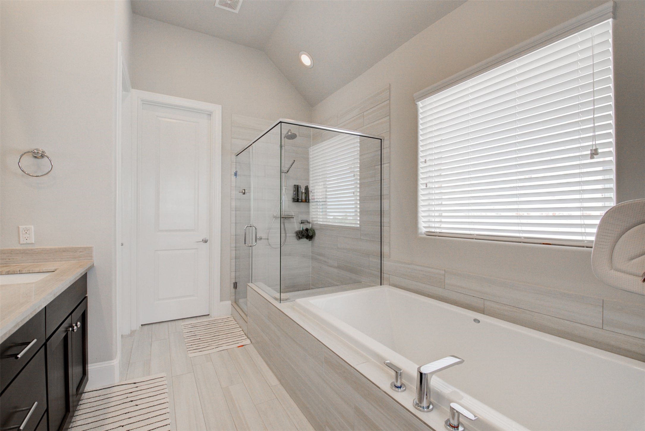 9664 Knight Road Houston, TX 77045 - Photo 26 of 33 a bathroom with a tub a sink and a shower