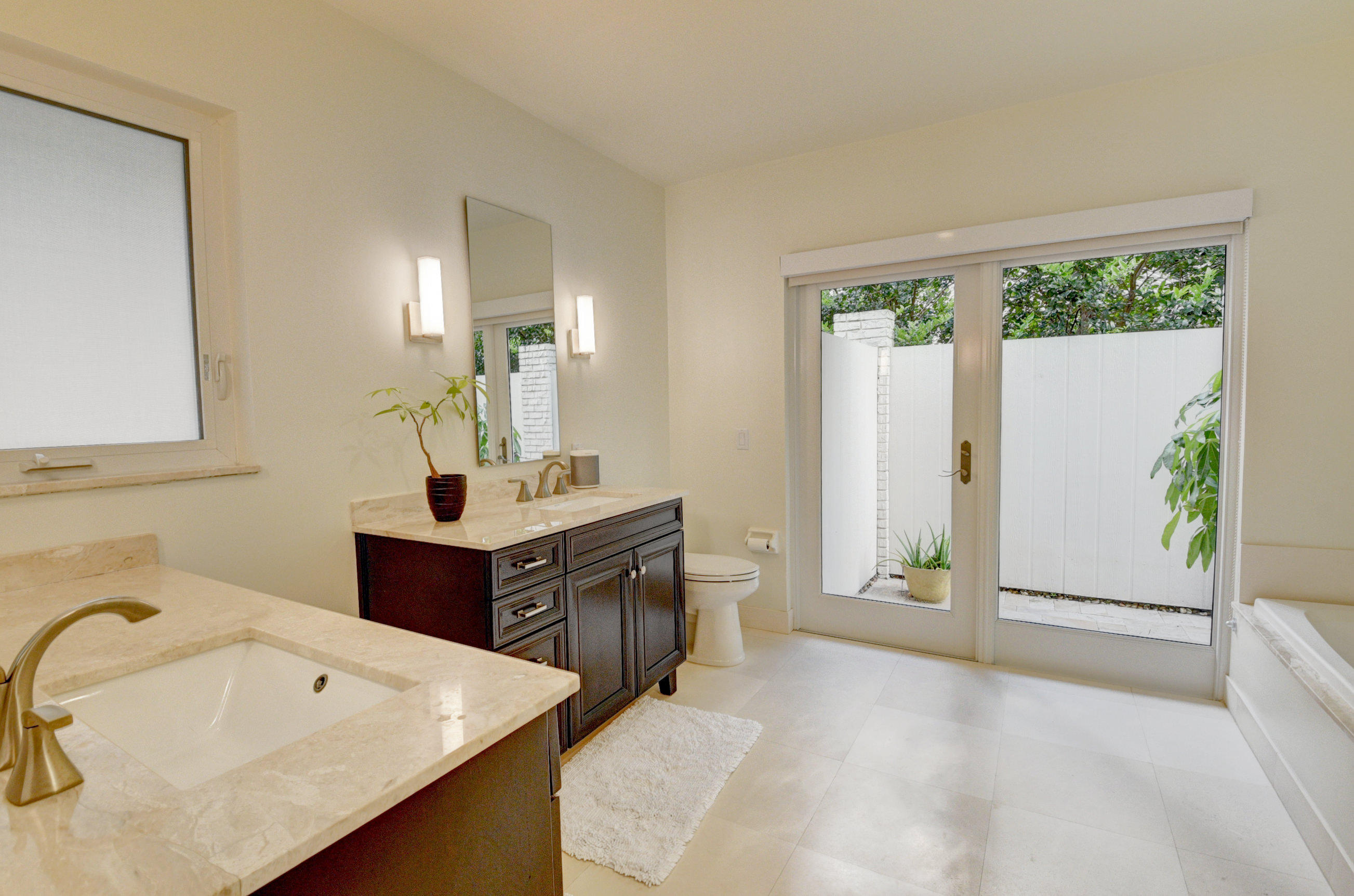 7624 Marbella Terrace Boca Raton, FL 33433 - Photo 27 of 55 a spacious bathroom with a sink and a mirror