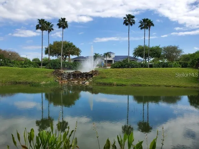 a view of a lake with a big yard