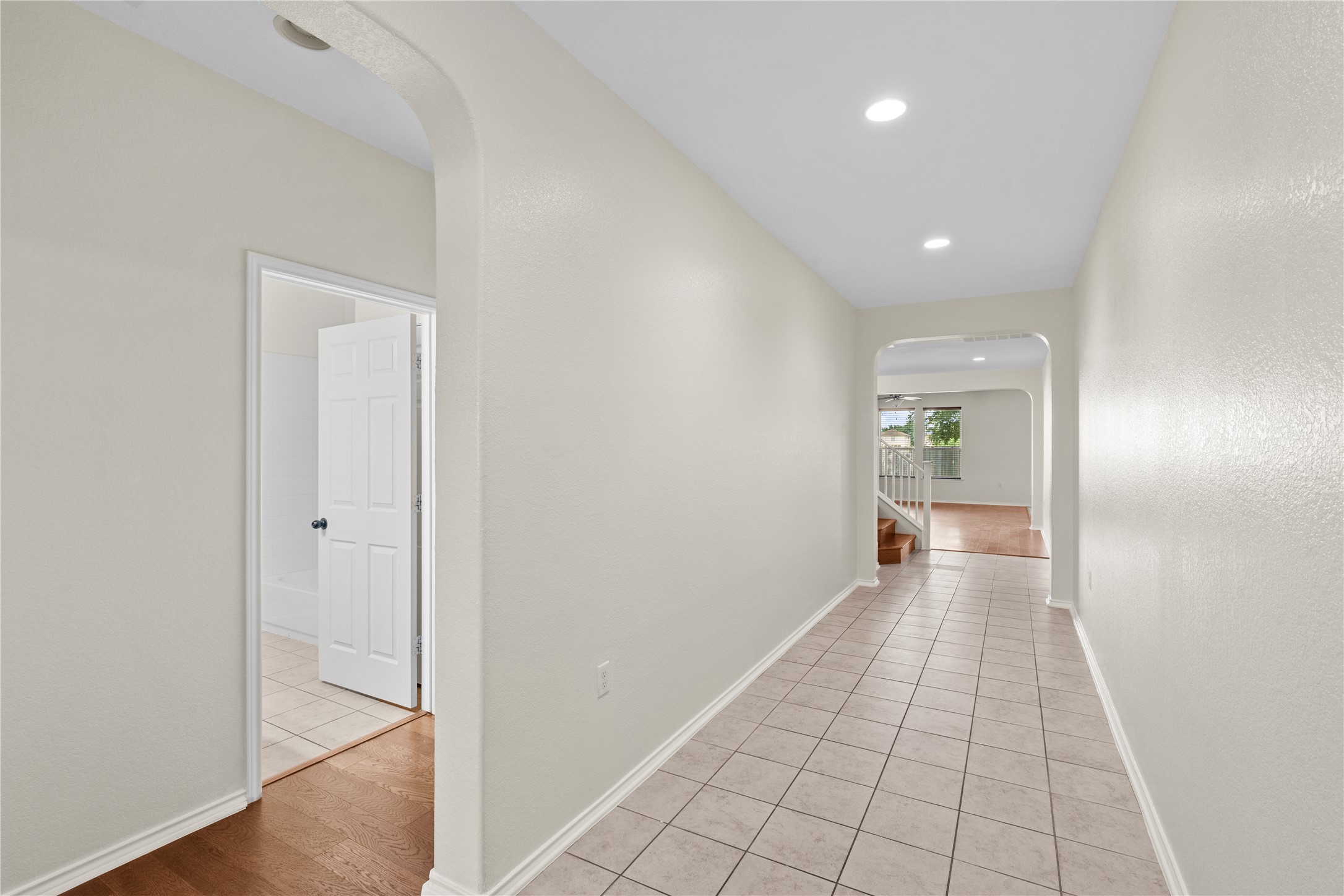 8613 Capitol View Drive Austin, TX 78747 - Photo 3 of 33 A well-lit entry hall with tile flooring transitions to rich hardwood floors.