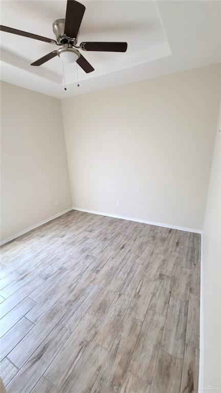 5007 North Hiawatha Drive, Unit 4 Pharr, TX 78577 - Photo 12 of 14 a view of a room with wooden floor and white walls