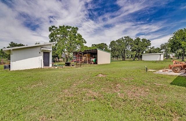 3952 J J Rendon Road Burleson, TX 76028 - Photo 22 of 25 View of the run in shelter used for horses, and now for equipment storage.