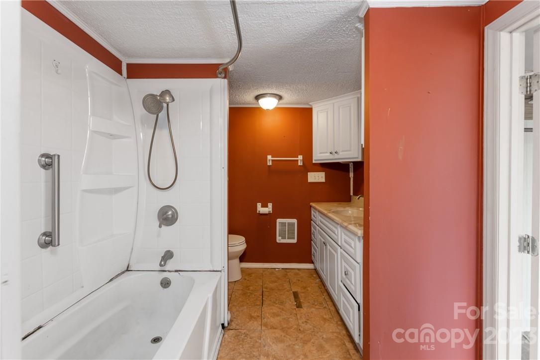 5 Cane Crest Circle Fairview, NC 28730 - Photo 11 of 13 a bathroom with a tub sink and mirror