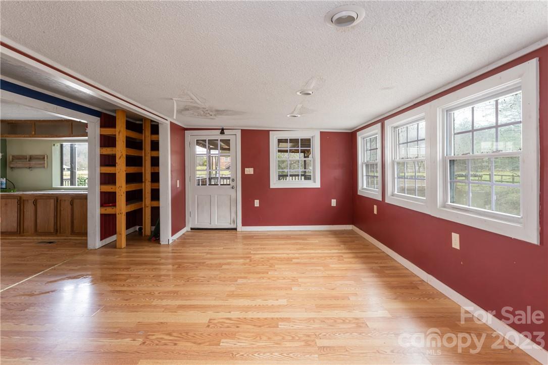 5 Cane Crest Circle Fairview, NC 28730 - Photo 12 of 13 a view of an empty room with wooden floor and a window