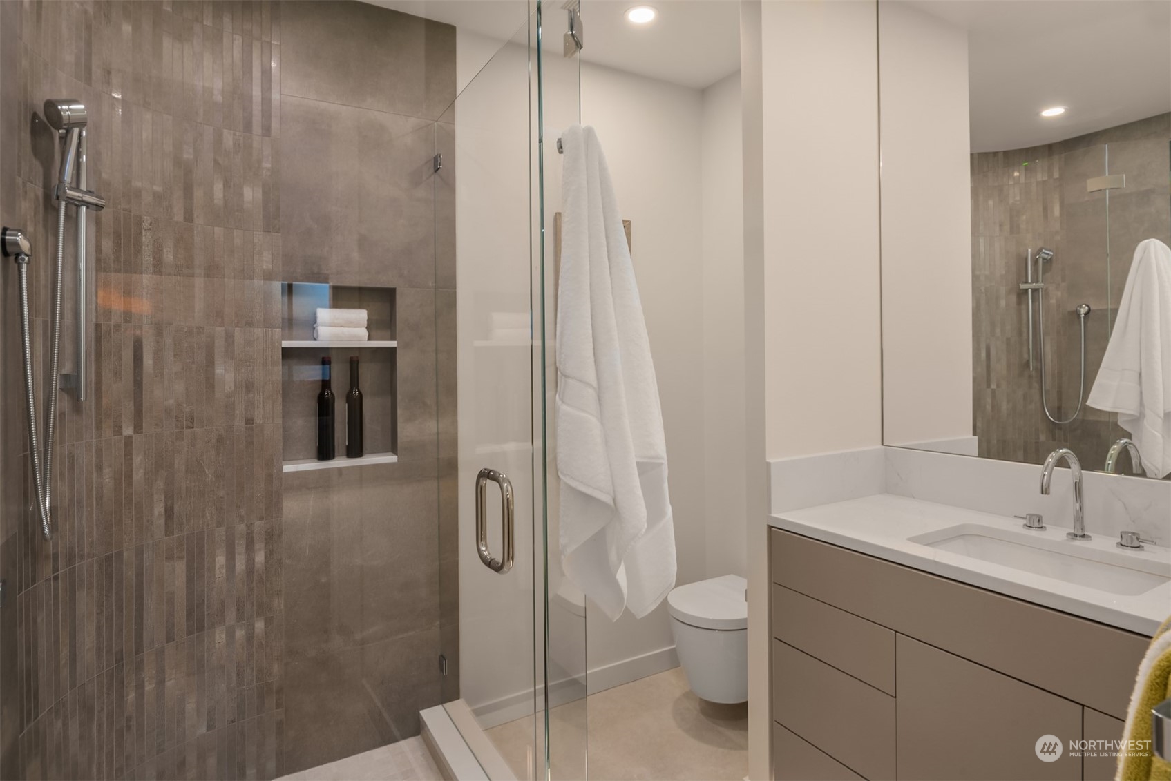 7329 Northeast 18th Street Medina, WA 98039 - Photo 29 of 39 a bathroom with a shower toilet and sink