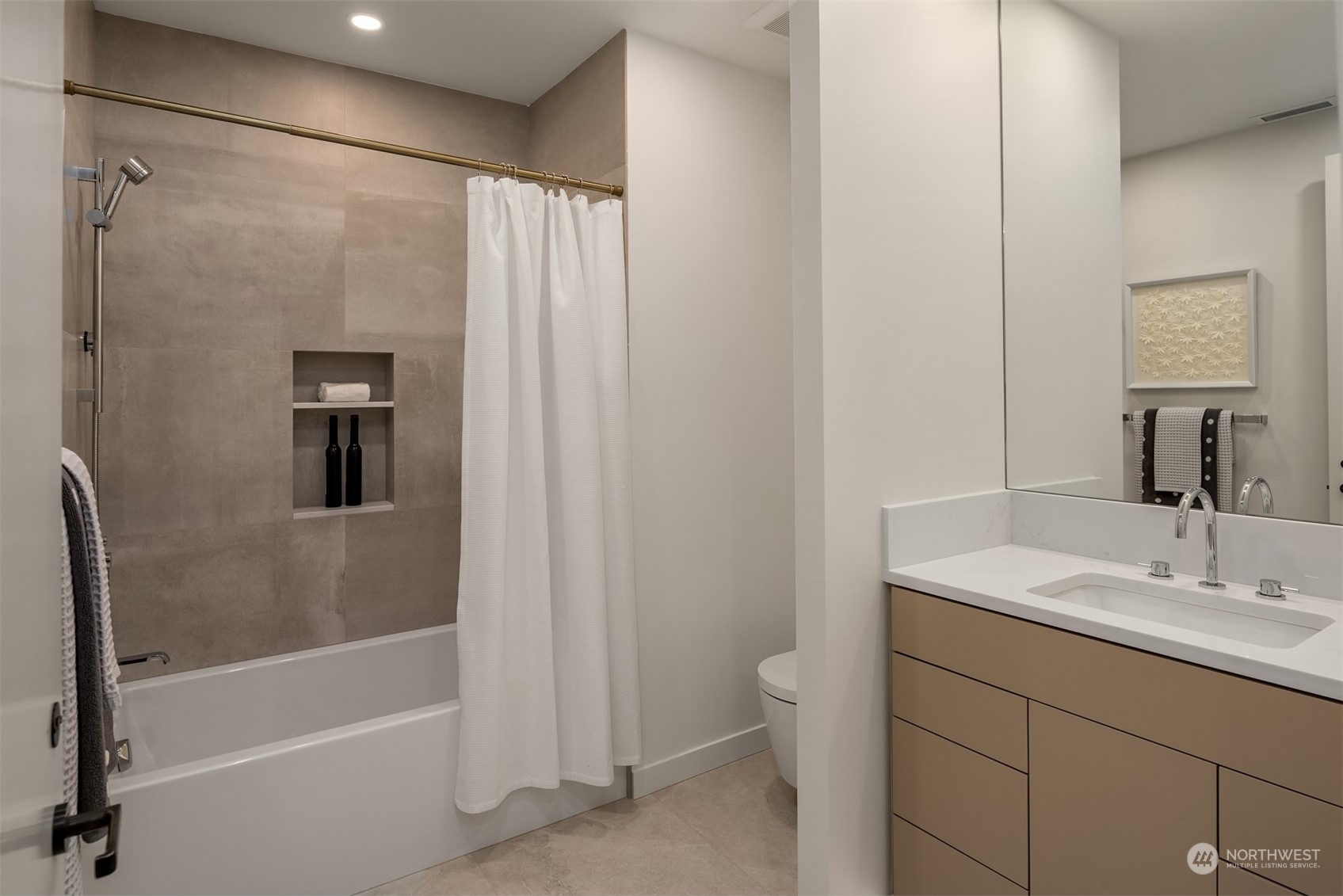 7329 Northeast 18th Street Medina, WA 98039 - Photo 31 of 39 a bathroom with a sink a toilet and shower