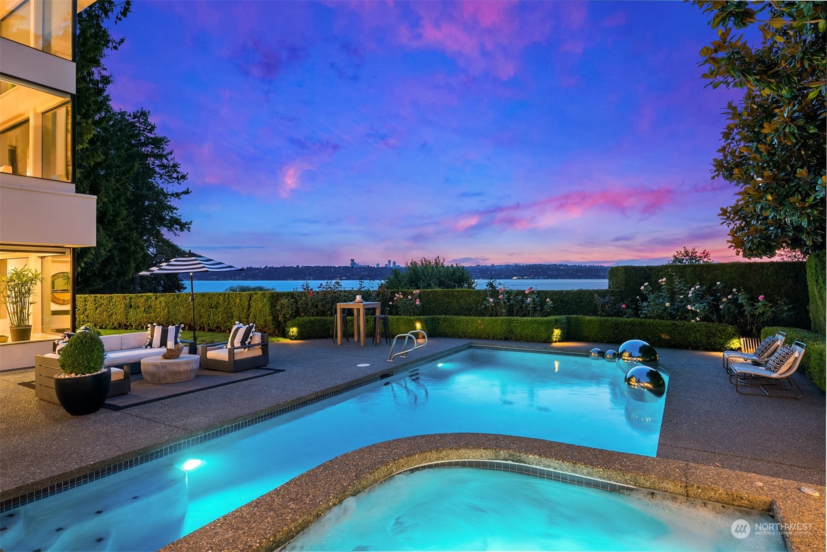 7329 Northeast 18th Street Medina, WA 98039 - Photo 34 of 39 a view of a swimming pool with a patio