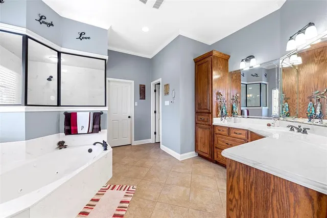 a large white kitchen with a large window